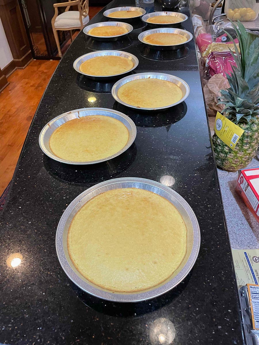 Bake yellow cakes (only about 10 min) in disposable pie pans. Use 8 pans (normally would use only 4) to create half thickness cakes. Very liberally spray cooking oil into pans to allow easy separation later on.