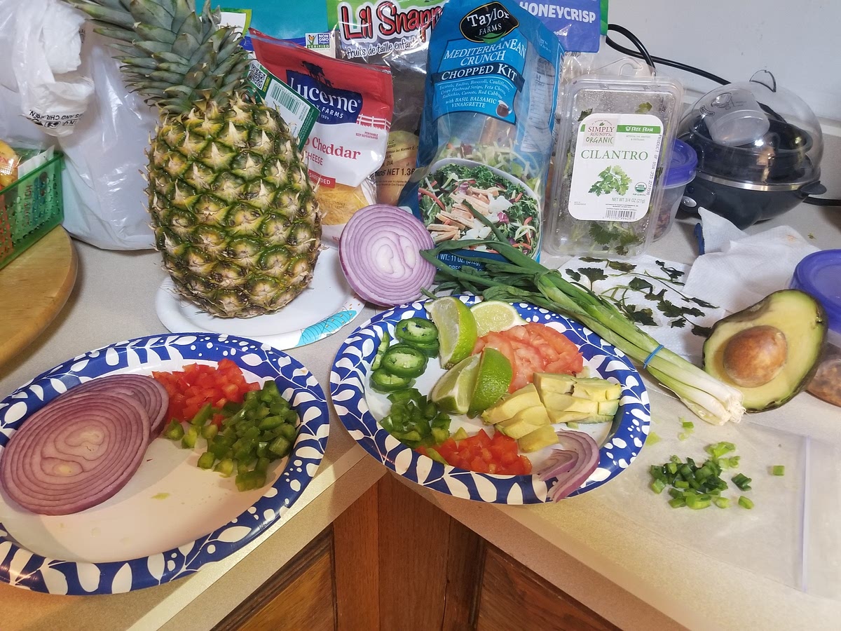 1. Finely chop all veggies. Set aside some red and green peppers for garnish at end. Set aside some tiny sprigs of red onion also for garnish.