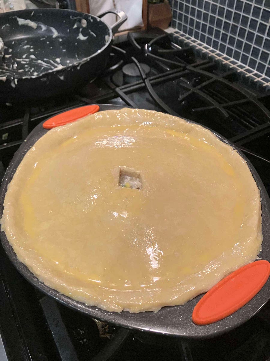 Brush generously with egg yolk and milk topping mixture.