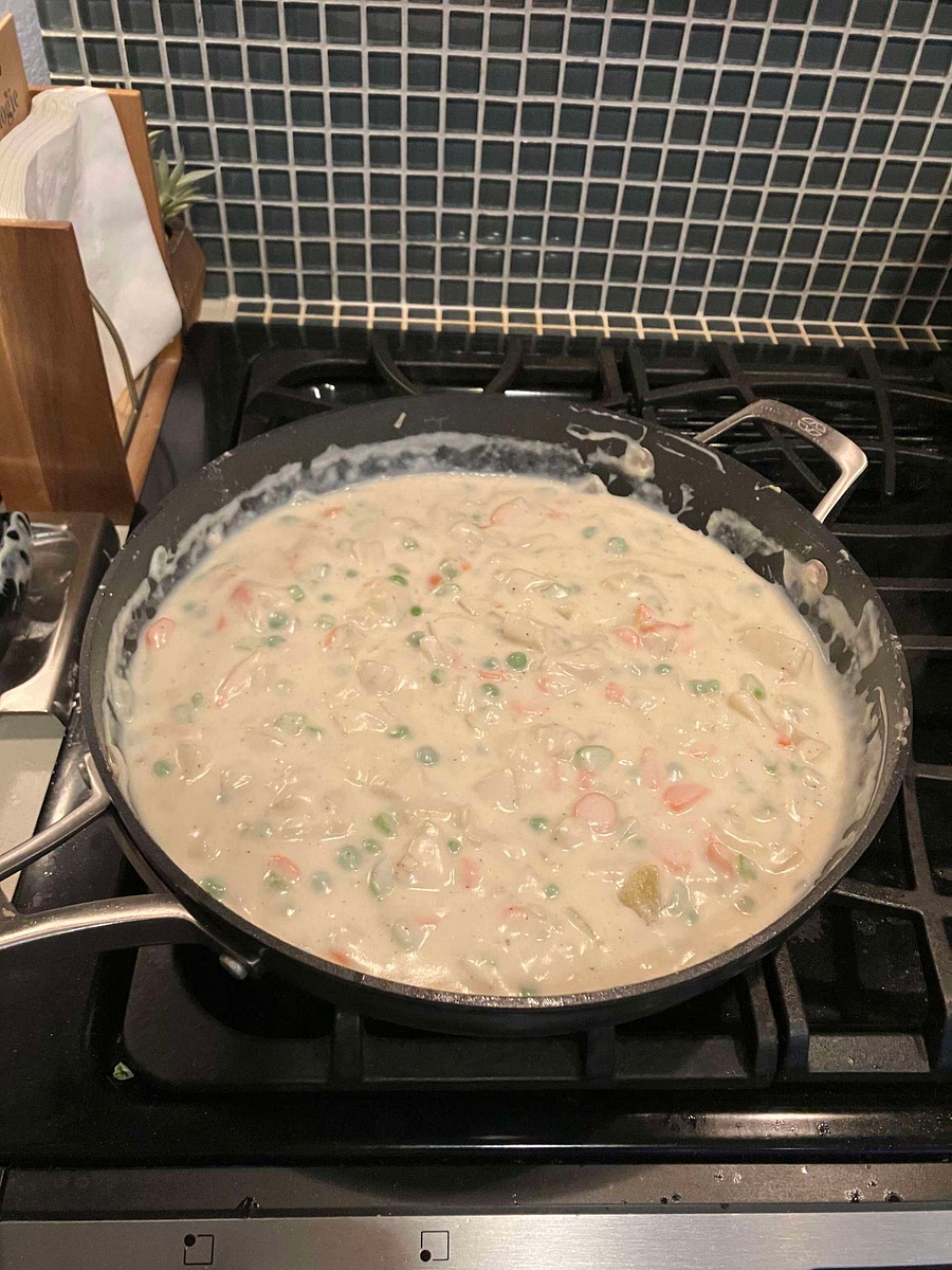 Cook and stir over medium heat until mixture boils. Season with salt and pepper.