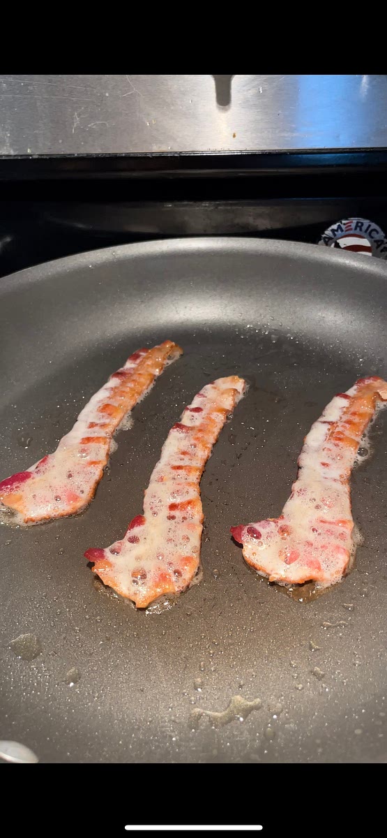 Cook 3 pieces of bacon on medium-heat.