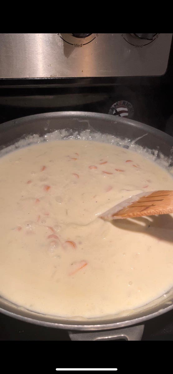 Slowly add in 1 1/2 cup of chicken broth and 1 1/4 of heavy cream. Mixing continuously. After mixed bring to a light simmer. Sauce will thicken.