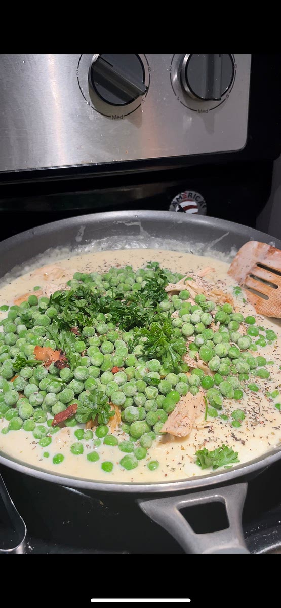 Lower heat. Add in 2 cups of chicken, 2 cups of peas, bacon, & 1 tsp of each seasoning. Mix together. Taste or add whatever else you want.