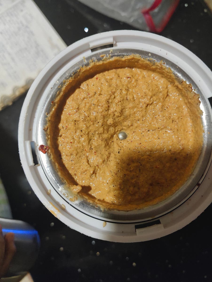 First grind without water, then add a bit of water and grind it to a fine paste. Add as much water needed.