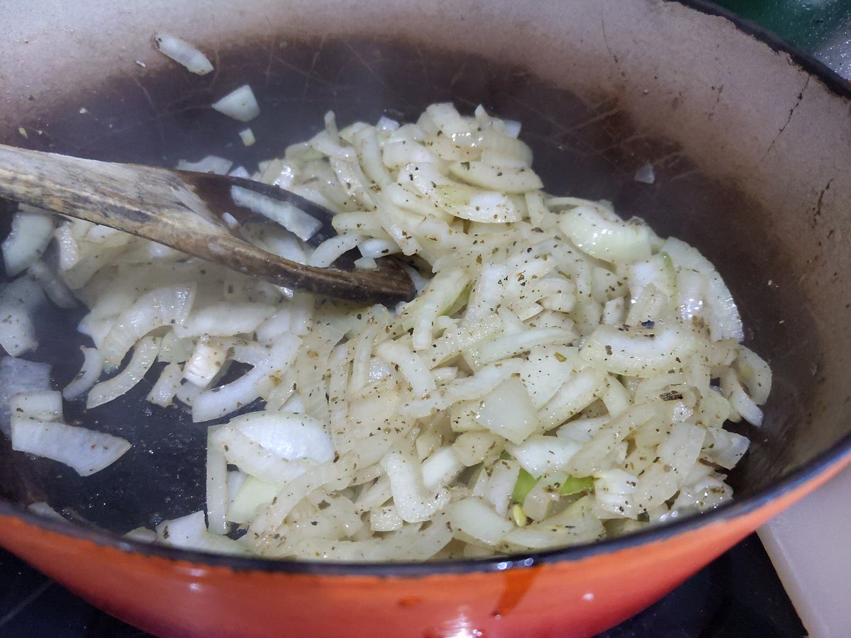 Add the onions to the pan, with the leaves from the thyme sprigs, and cook over a low to moderate heat until the onions are soft and pale gold. Stir in the flour and leave until it is the palest biscuit colour, then pour in the beer and add the bay leaves. Once the sizzling has subsided and it is approaching boiling point, return the beef and its juices to the pan and lower the heat. Season with salt and black pepper, cover with a lid and place in the oven. Leave for a good hour to an hour and a half.