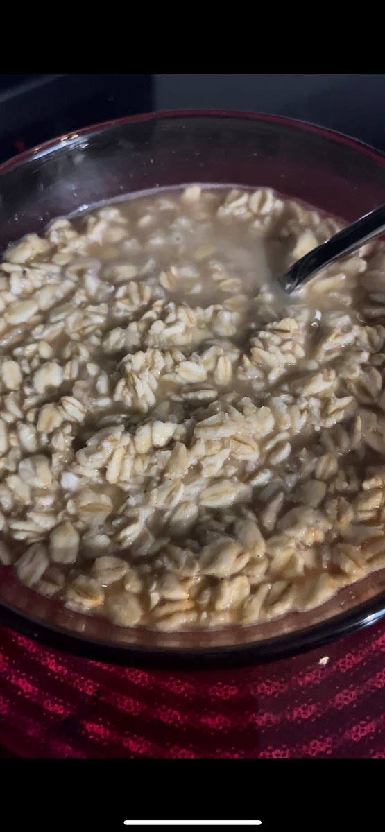 In a small pot on the stove combined one cup of water, half a cup of oats, and 1 tablespoon of maple syrup.