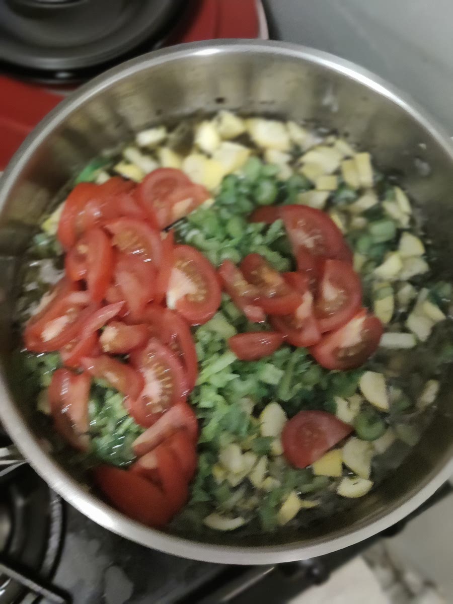 Add Vegetable stock, water, and tomatoes. Cook for 8 - 10 minutes.