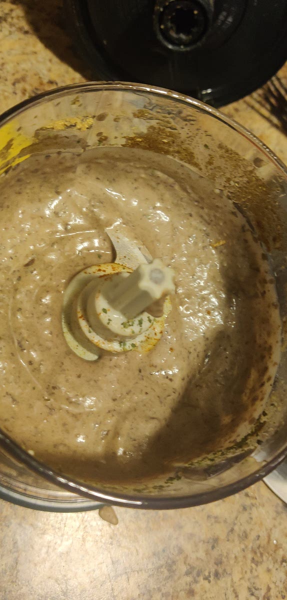 Add reserve Black Bean liquid 1 tablespoon at a time, process. Repeat until desired consistency.