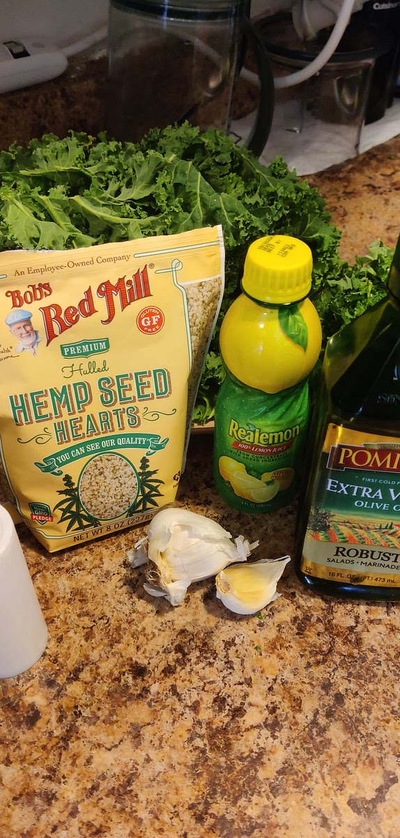 Add garlic and hemp seeds to food processor, pulse until mixed.