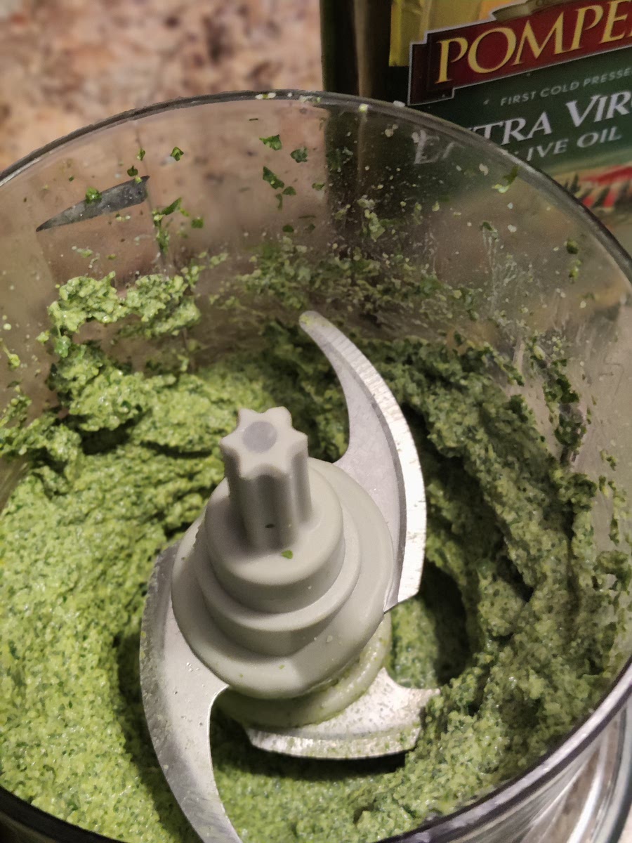 add olive oil, pulse.
use a spatula to scrape the sides, pulse until mixed.