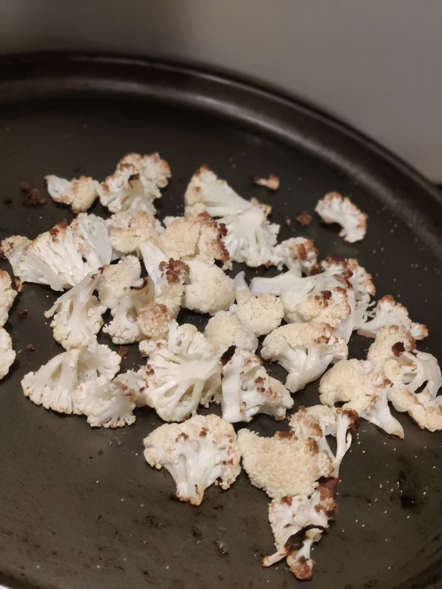 Place cauliflower on second baking sheet, drizzle with olive oil, sprinkle salt and pepper. Bake both for 20-25 minutes or until the edges become golden brown.