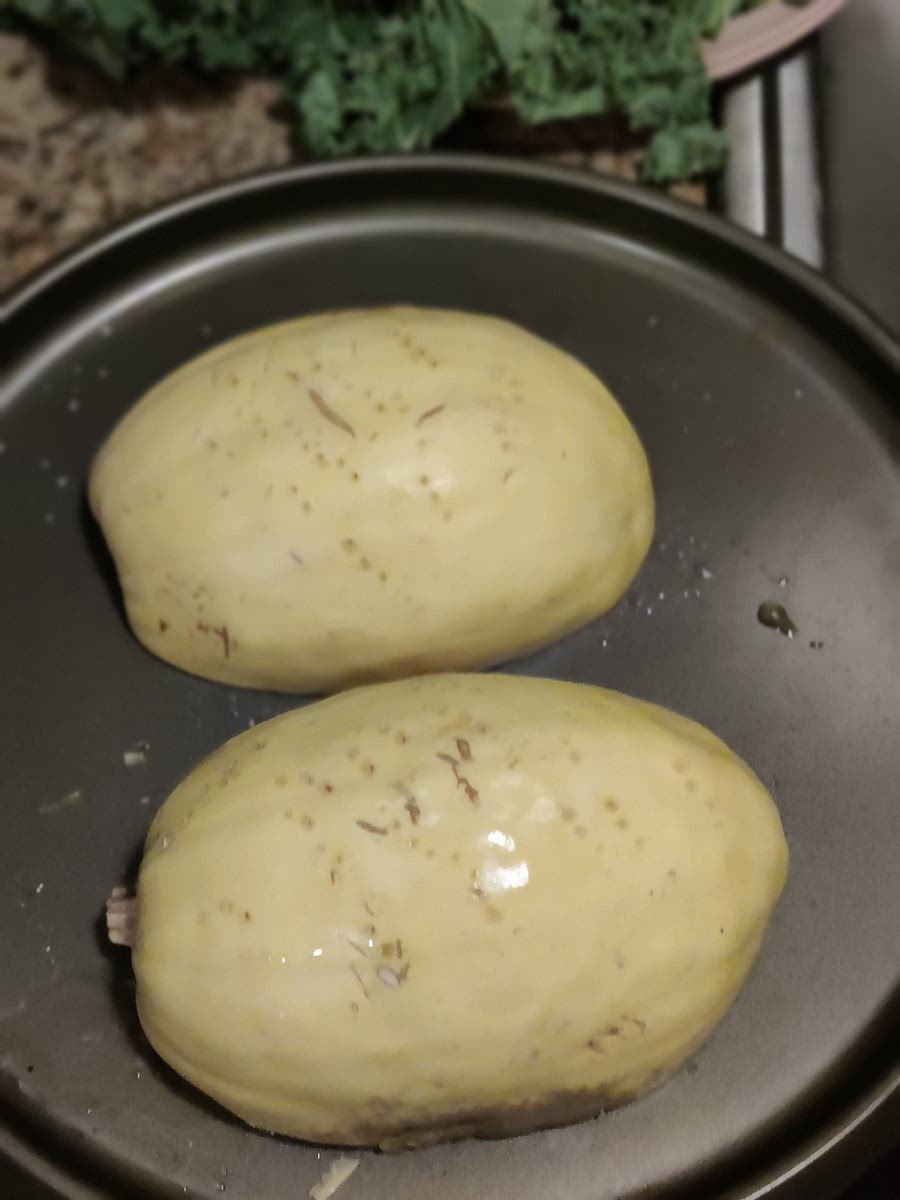 Once squash is cool to the touch, scrape with fork and shred the insides down to the shell. Put in pot on low heat. add baby spinach, lemon juice, seasoning to taste.