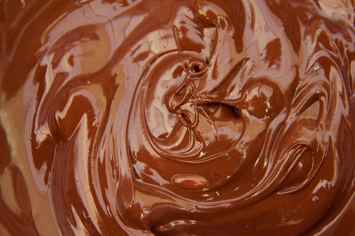 Gently add the egg whites to the mixture using a spatula.