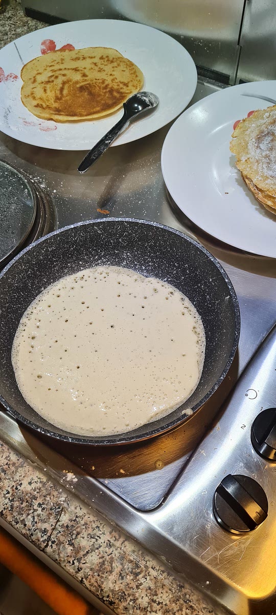 Heat a pan then low the heat to medium high , Pour 1/4 of a cup into the center of the pan and twirl the pan in a circular motion to distribute the batter