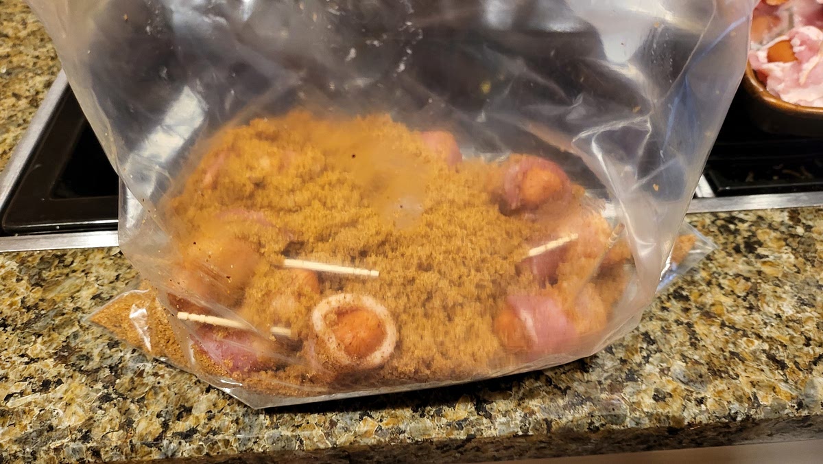 Place several of the wrapped Smokies into the Brown Sugar Mixture and Toss Gently.