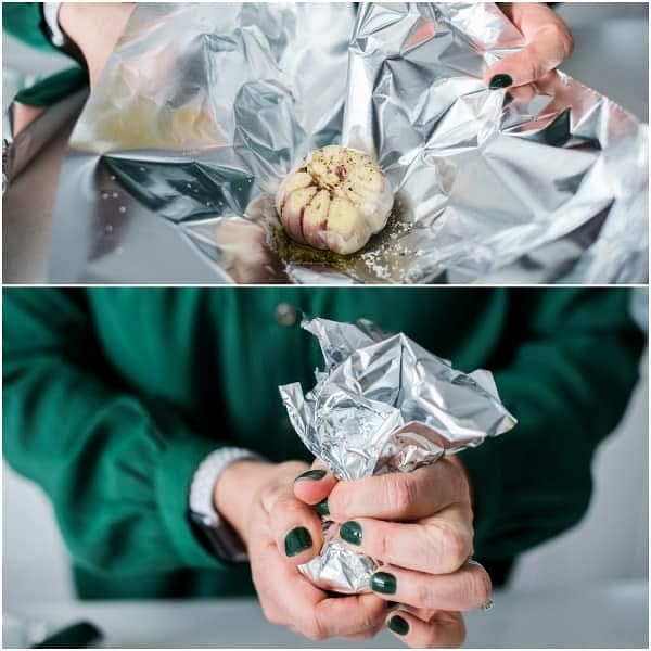 Slightly chop off the very tip of 2 cloves of garlic heads place in tinfoil. Drizzle the tops in olive oil and fold the foil completely around the head of garlic. Then place on the covered baking sheet.