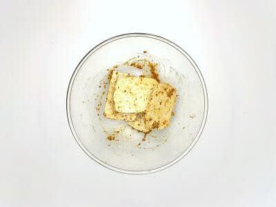 Meanwhile, drain the tofu and pat it dry with kitchen paper, then slice the tofu into 4[8] pieces Add the sliced tofu to a bowl with the soy sauce and wholegrain mustard Give everything a good mix up, then set aside for later – this is your mustard marinated tofu