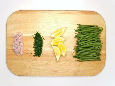 Boil a kettle Peel and finely dice the shallot[s] Finely chop the chives Roll the lemon[s] with your hand on a hard surface (to release more juice) and cut into wedges Trim the green beans