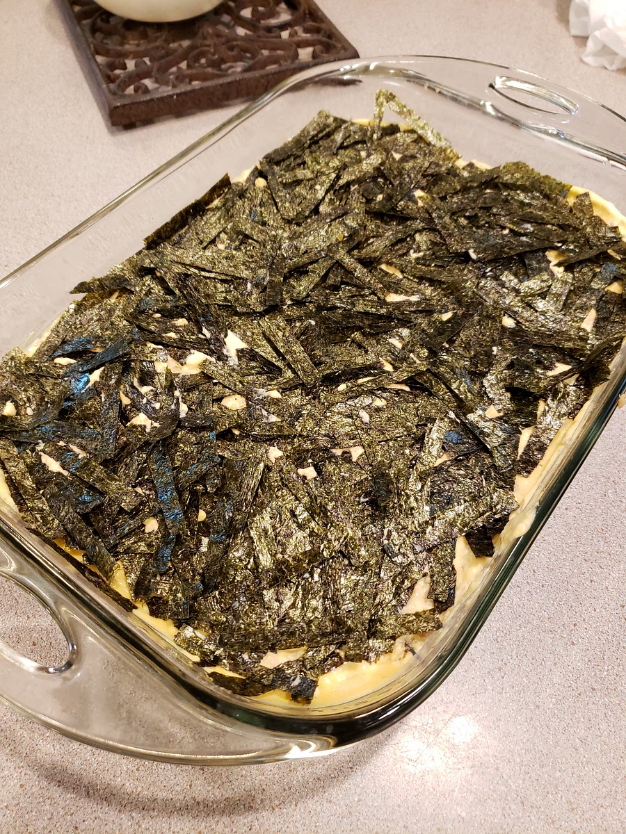 Sprinkle the seaweed strips in an even layer.