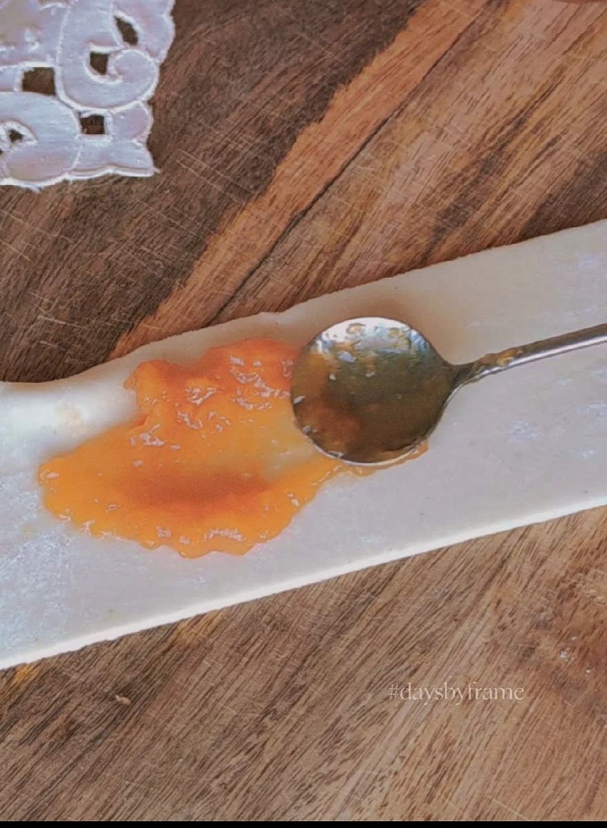 5) Place apricot jam to the center of the puff pastry sheet.