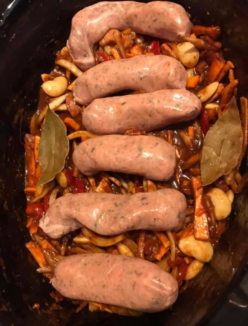 Brown the bacon strips (and sausages if desired) in a frying pan and add to the rest of the ingredients.
