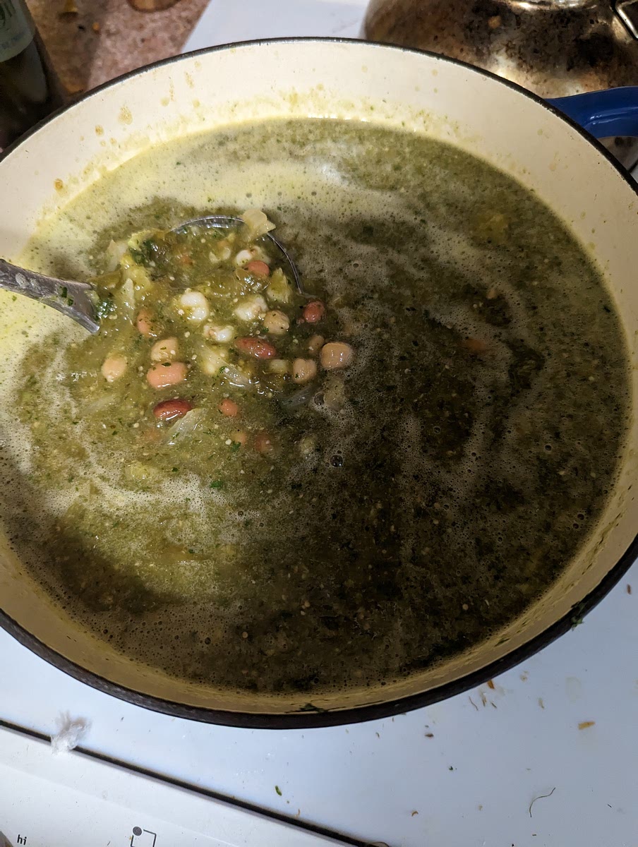 Add the hominy and beans cook on simmer for 45 mn