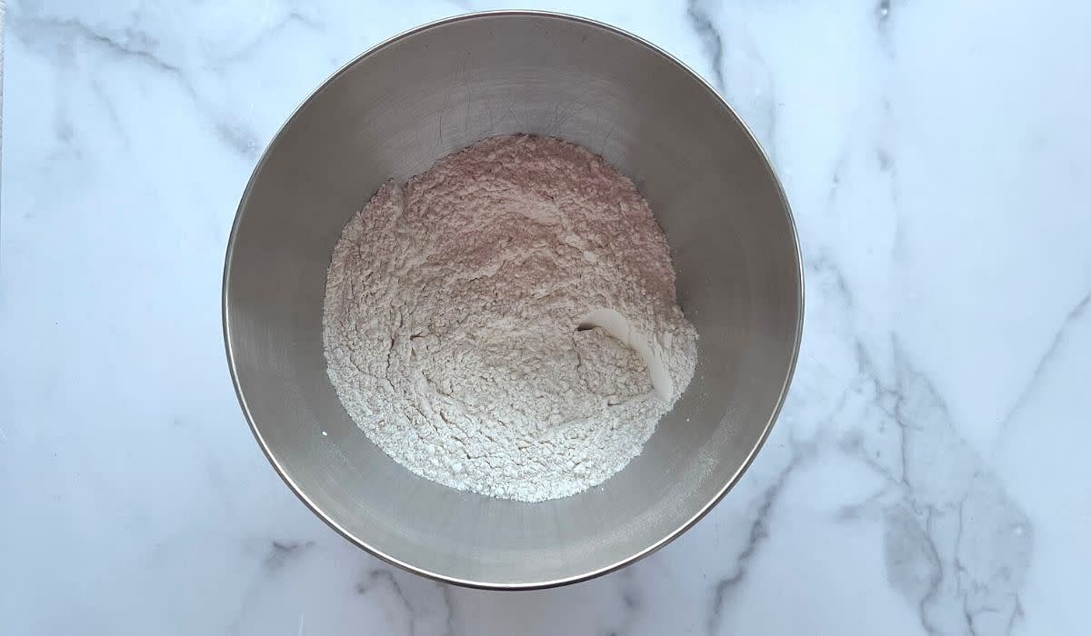 Step 2: Whisk the flour, baking powder, baking soda, salt, and ground cinnamon together in a bowl and set aside. Be sure to spoon and level the flour by adding the flour to the measuring cup with a spoon and then leveling off the flour with a knife. This ensures the flour is not packed in, which prevents extra flour from being added to the bowl.