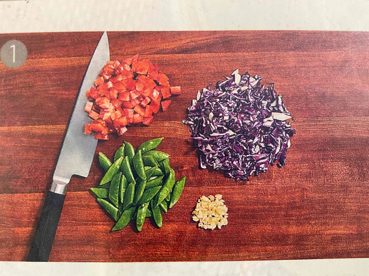 Rough chop cabbage
Remove any fibrous strings from snap peas. Have widthwise
Mince garlic.
Small dice Roma tomato into pieces, about 1/4-inch each.