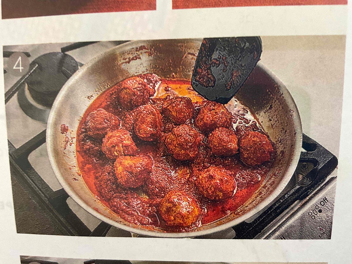 Heat about 1 1/2 tablespoons cooking oil in a medium sauté pan over medium heat. Add meatballs to hot pan. Sear about 3 minutes, tuning occasionally. Add spiced enchilada sauce. Cook 5-7 minutes, or until sauce has reduced by about one-third and meatballs are fully cooked, stirring occasionally. (Ground pork is fully cooked when internal temperature reaches 160 degrees.) Remove from heat.