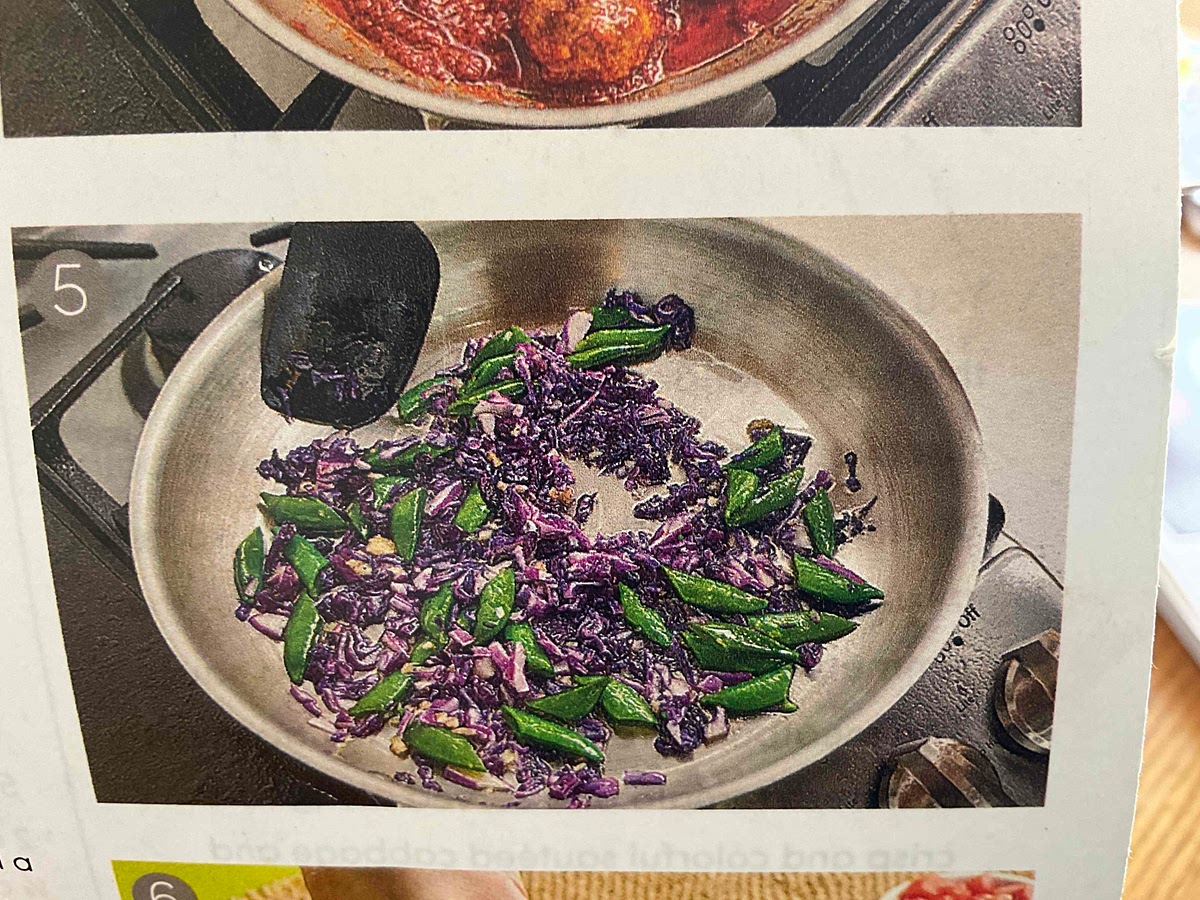 heat about 1 1/2 tablespoons cooking oil in a large sauté pan over medium heat. Add cabbage, snap peas, and garlic to hot pan. Season with about 1/4 teaspoon salt and a pinch of pepper. Cook 3-4 minutes, or until veggies are tender, stirring occasionally.