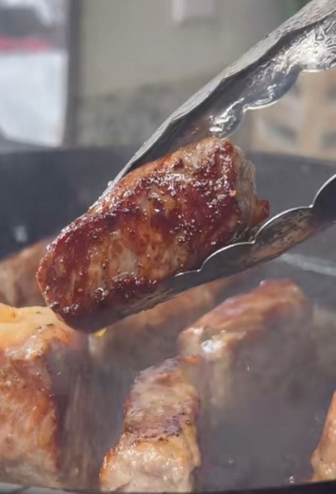 Sear steak on high heat until crust is golden brown. "The crust gotta be looking like this"