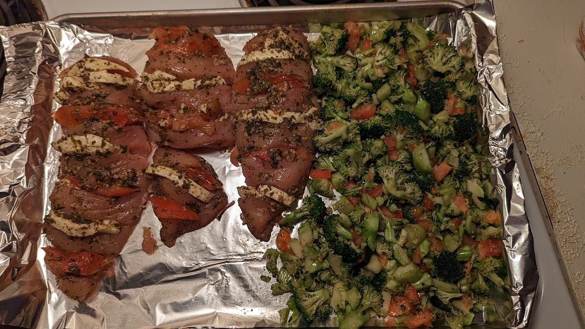 Bake until the chicken is no longer pink in the center and the broccoli is tender, about 25 minutes. Cut each breast in half and serve with the broccoli.