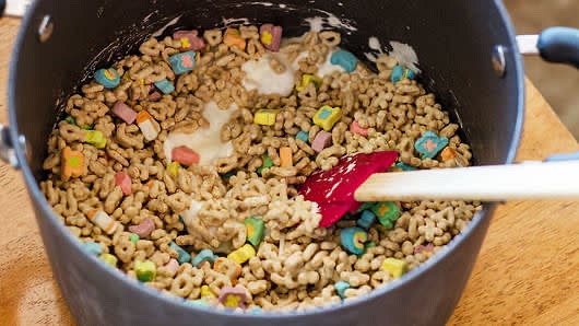In 3-quart or larger saucepan, melt 5 tablespoons butter over medium-low heat. Add marshmallows. Cook, stirring constantly, until marshmallows are almost melted. Remove from heat; immediately stir in 6 cups Lucky Charms™ cereal.