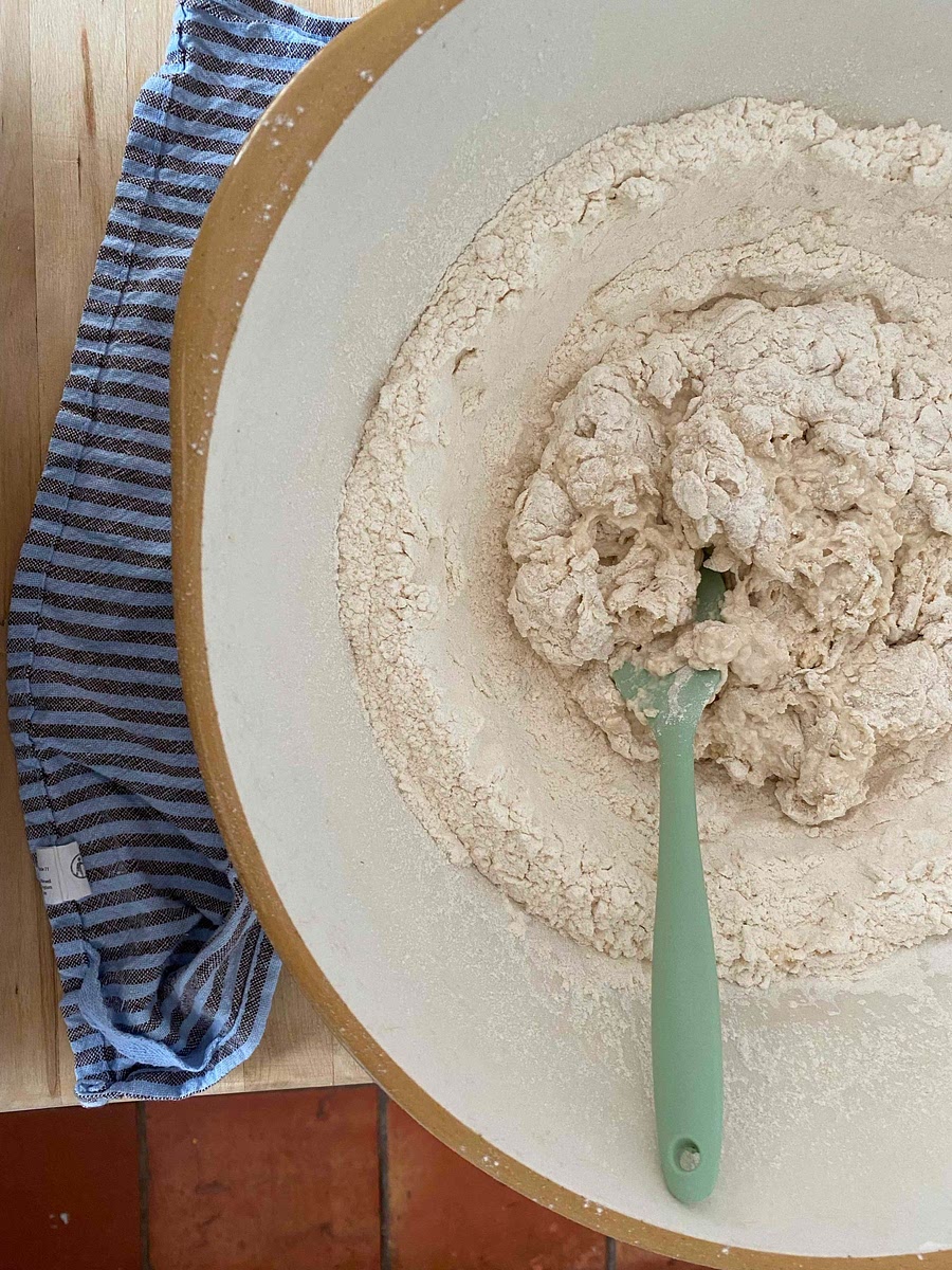 Mix the flour, oil and salt to combine and then make a well in the middle. Add a small amount of the yeast water and mix to combine. Slowly add the remainder of the water until you have formed a dough.