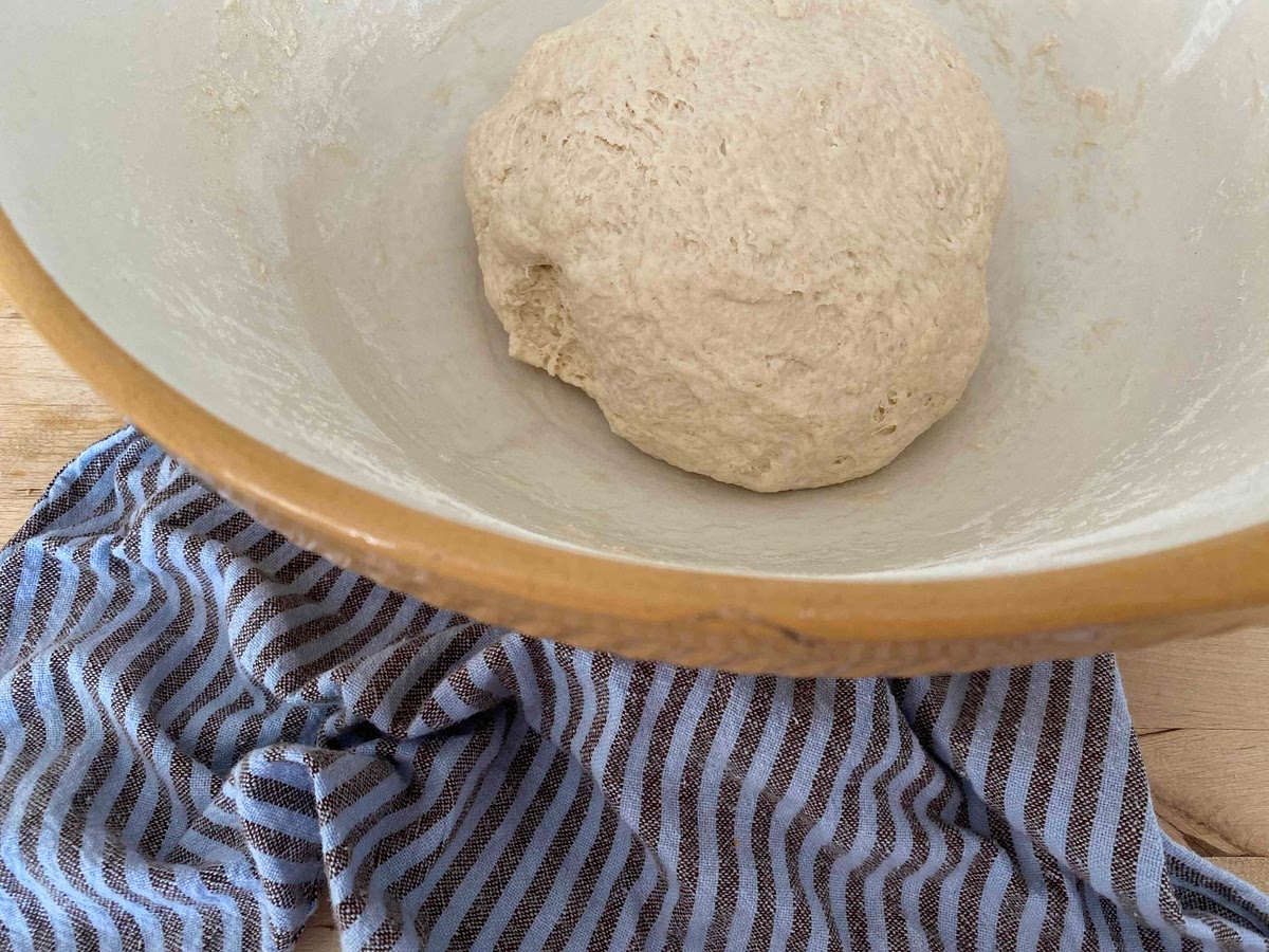 With your hands knead the dough for about 5 minutes until it has become smooth and formed a ball.