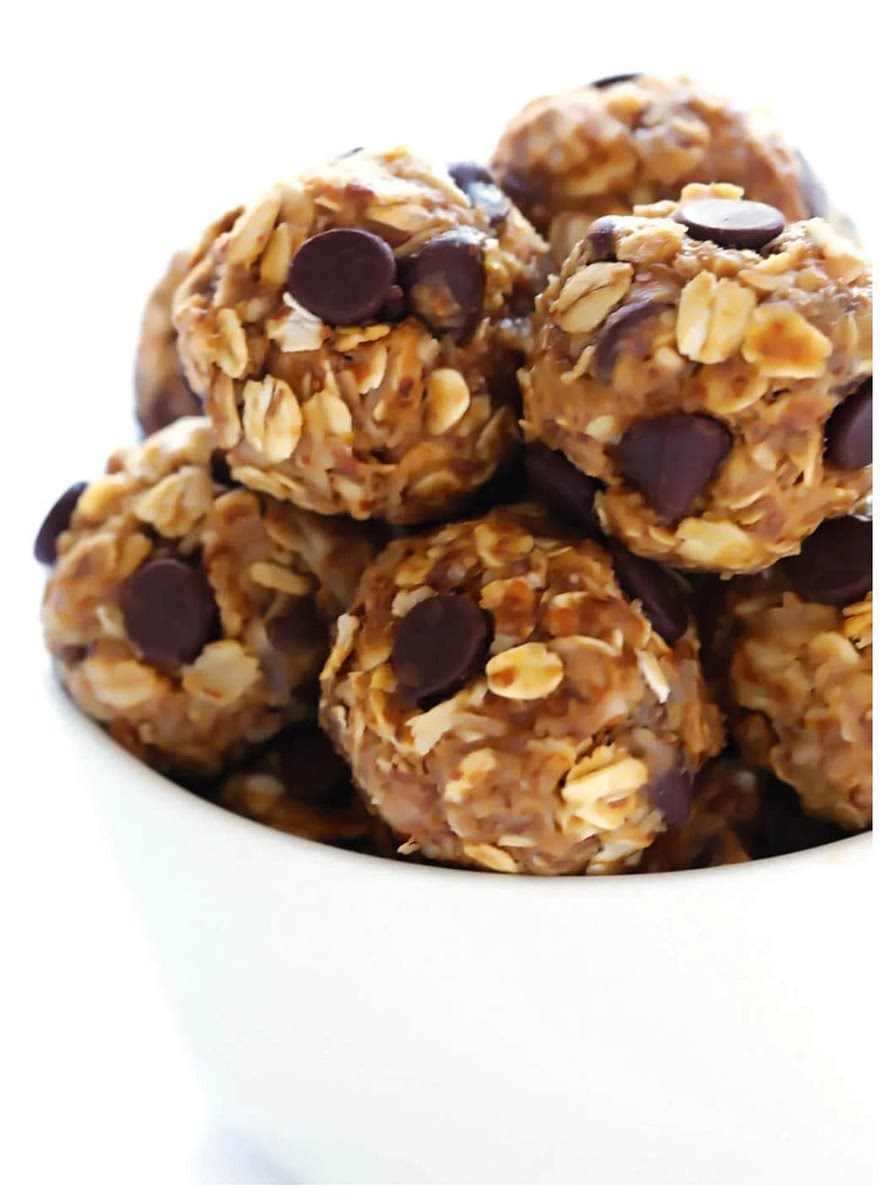 Combine dry ingredients except choc. chips.
Microwave nut butter and honey for 20 seconds and and pour over dry ingredients.
Mix well and add in choc. chips last.
Roll into balls.
Cover and refrigerate for up to 2 weeks.