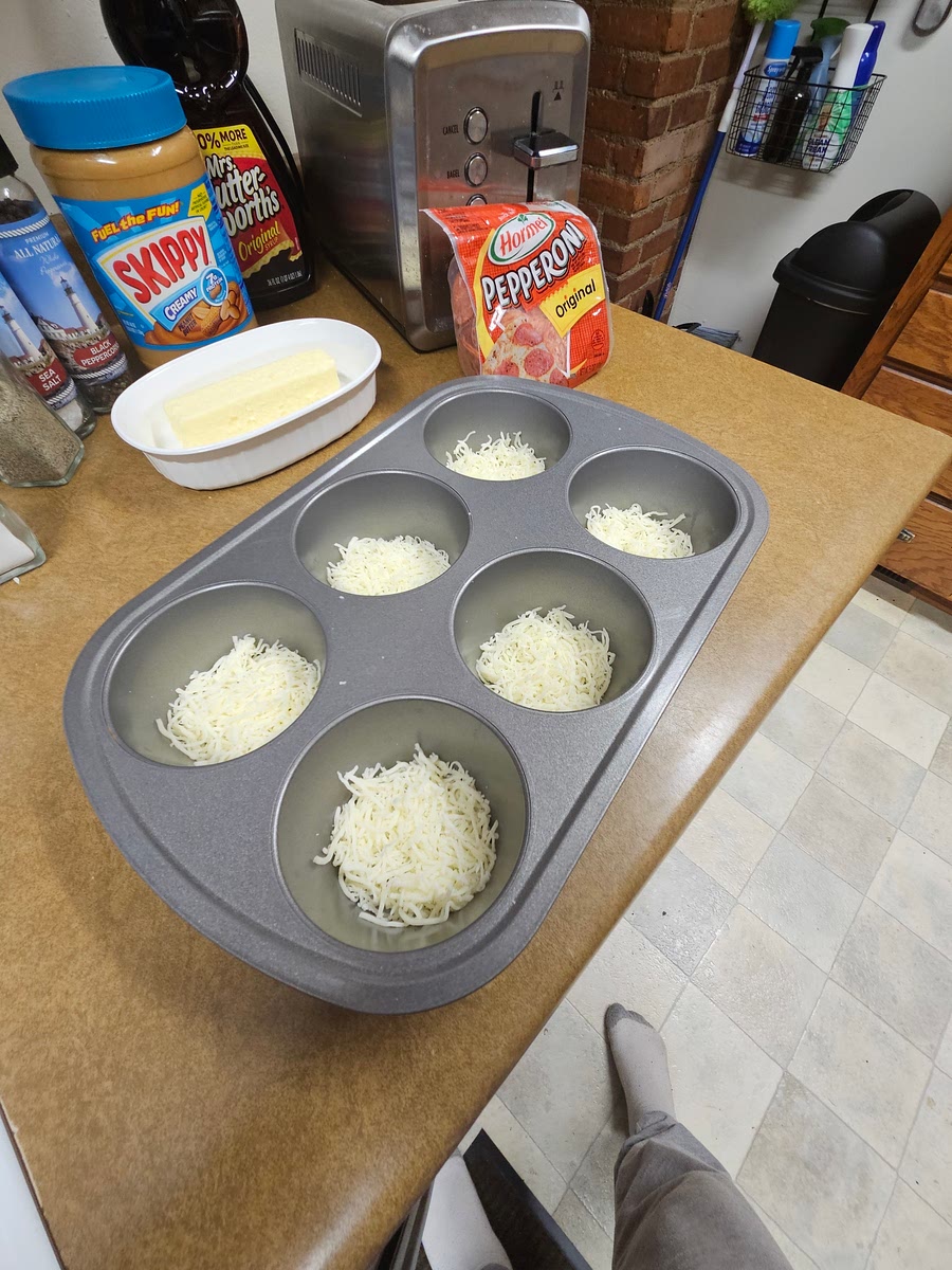 Get a large muffin tin cover the bottom with the Italian cheese, then put it in the oven at 375 degrees F, then take it out of the oven and sprinkle the Italian seasoning and add pepperoni then put it back in the oven for 5 minutes then when you take it out let it cool.