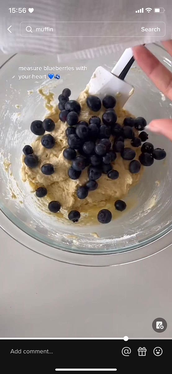 Fold in blueberries and scoop evenly into a muffin pan lined with baking paper.