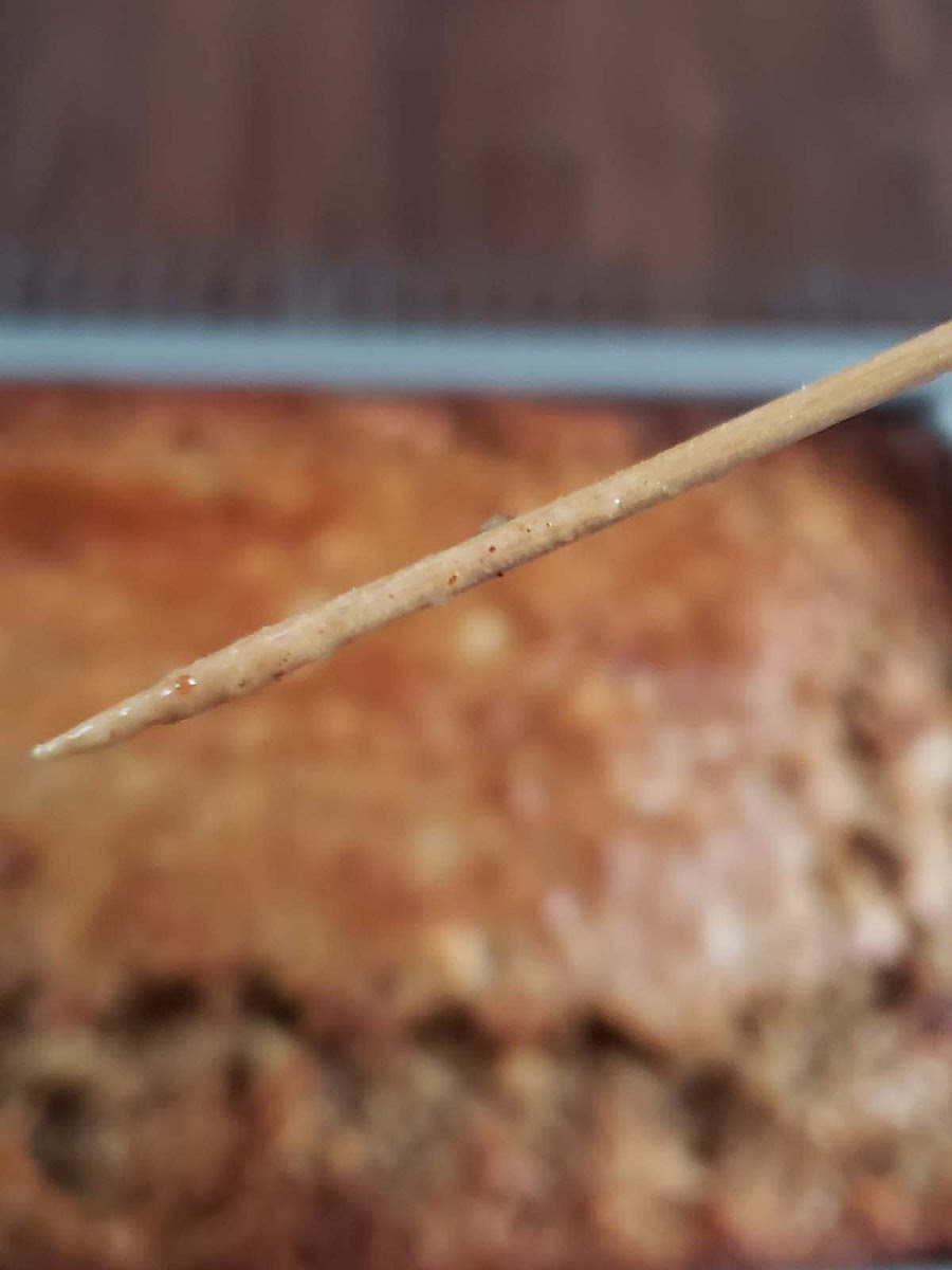 Finally you want to put the raw banana bread into the preheated oven and bake for 50-60 minutes, or until a toothpick comes out with NO RAW BATTER on it. TIP: If the toothpick is moist, that is normal because there is bananas in the cake, just look out for Raw Batter.