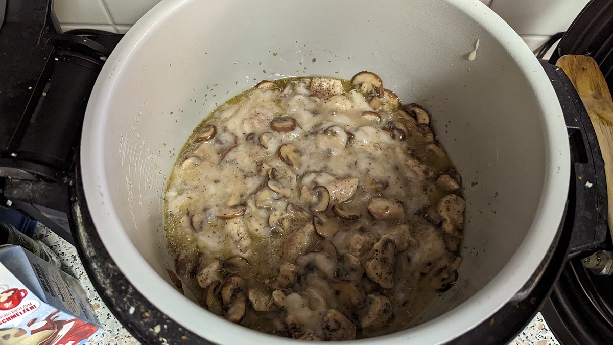 Then add and mix the can of cream of mushroom soup and 1/2 cup of chicken broth.