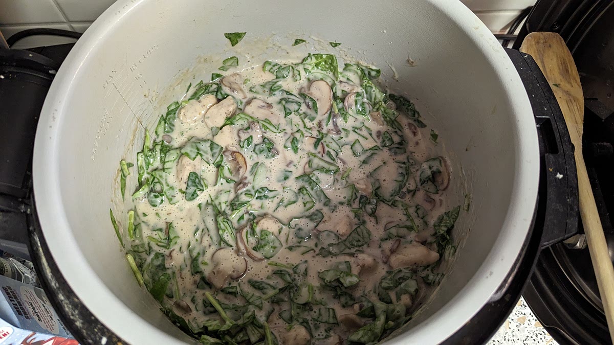Quick release once time is up, and then add the heavy cream, zest of lemon and the baby spinach.