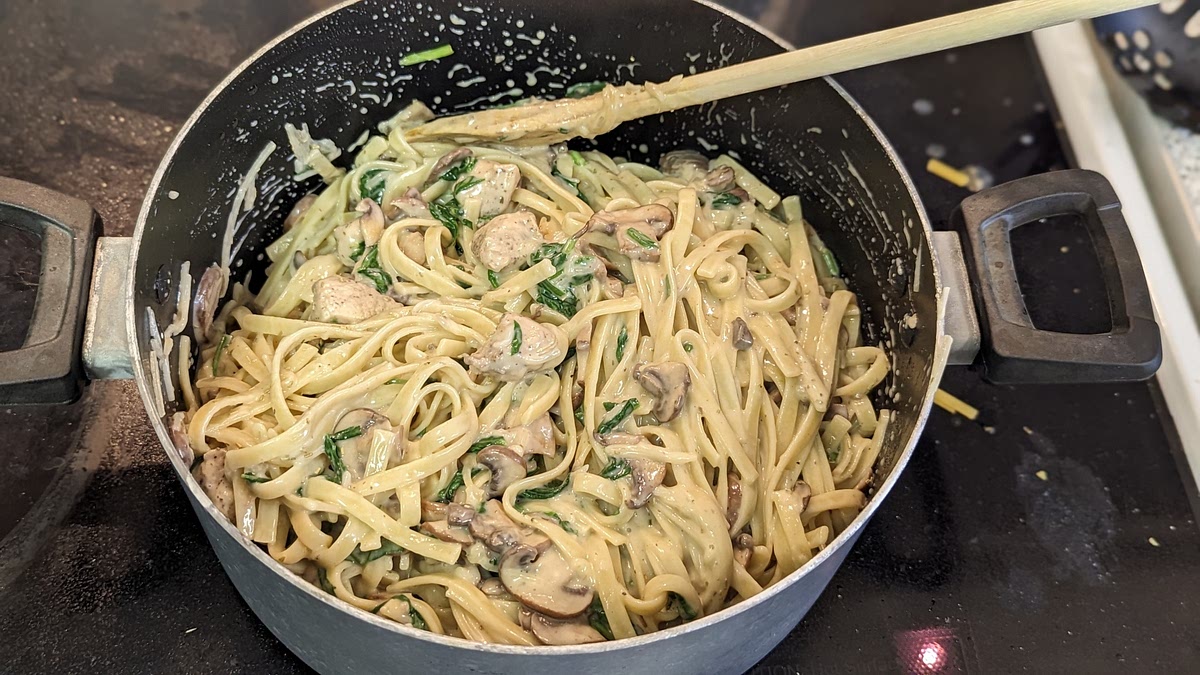 Mix the sauce in with the noodles in the other pot, and then add 1 cup of shredded parmesan cheese and some more minced rosemary. Serve and enjoy!