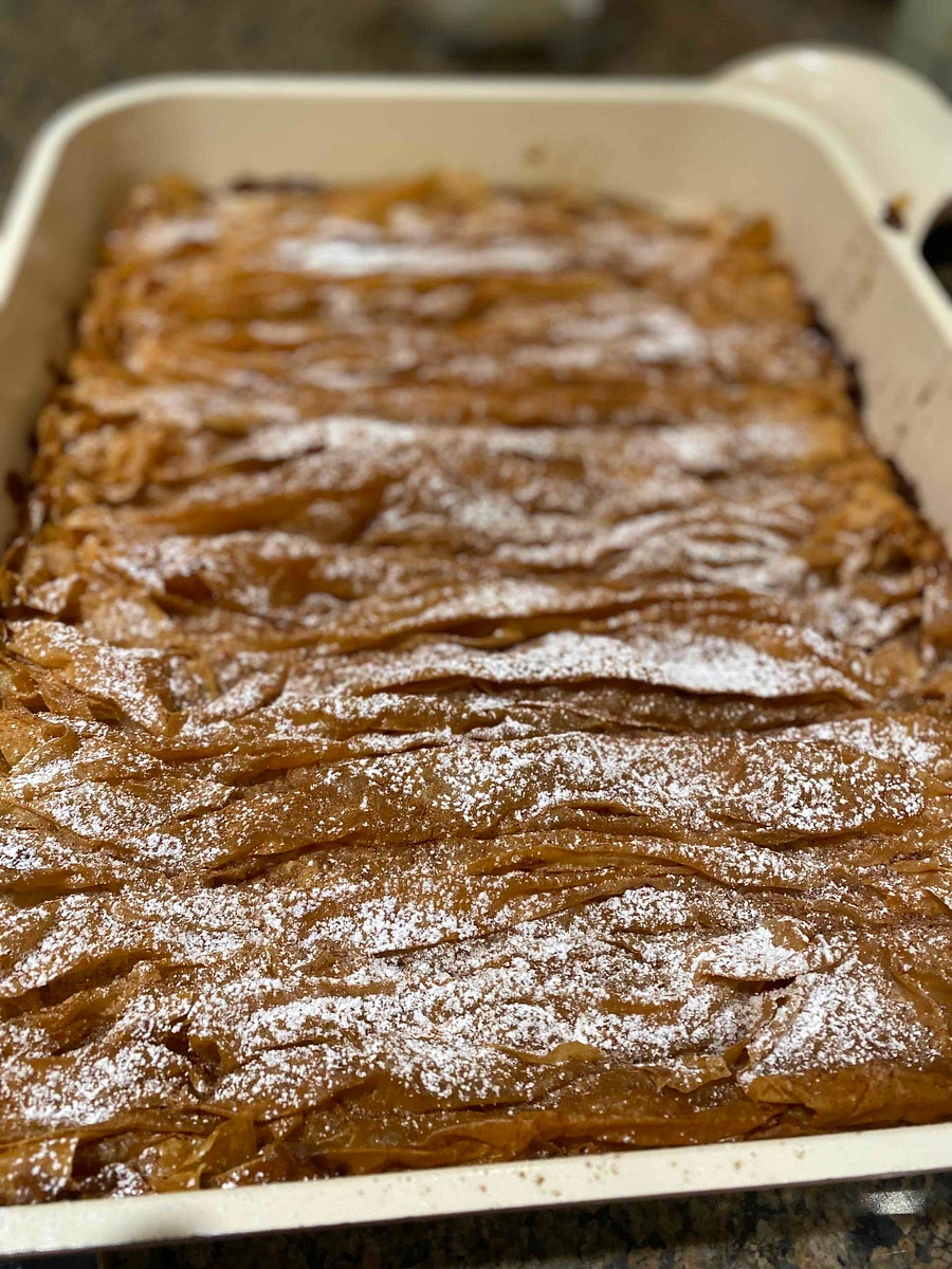 Once cooked, add powdered sugar and cinnamon