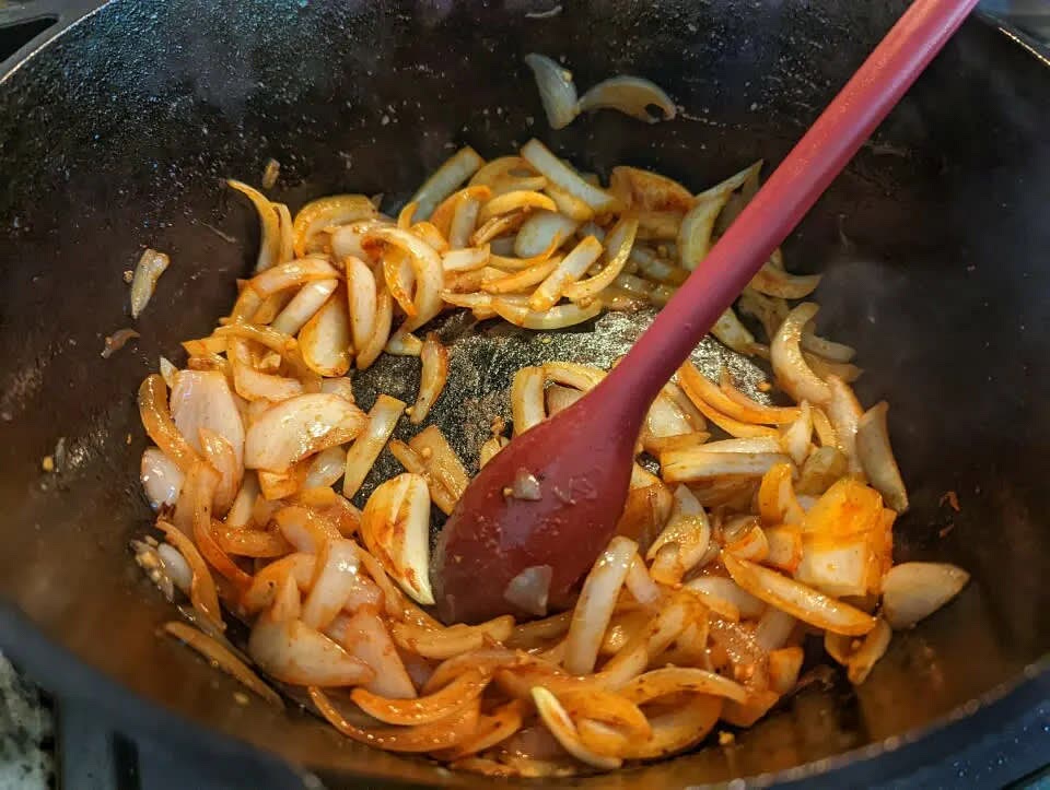 Stir in the Sazón Goya Con Azafran, cumin, and Better Than Bouillon.