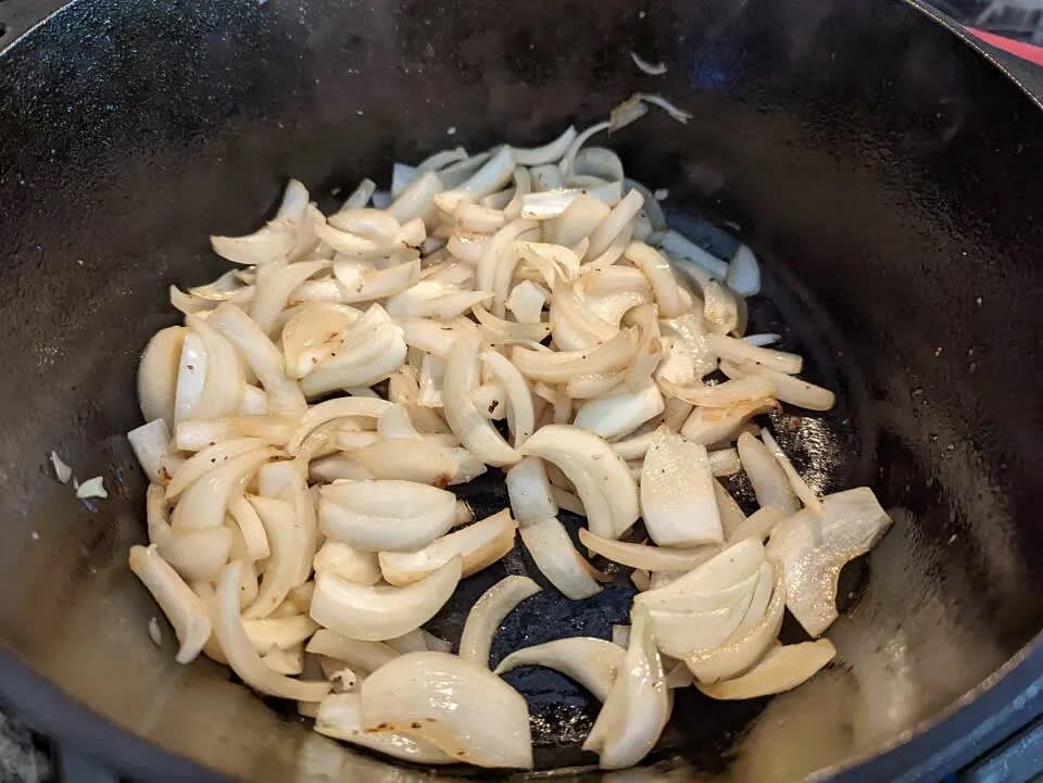 In the same pot, add onions and cook for 10 minutes until the onions become translucent and soften. Then, add garlic and cook for another minute.