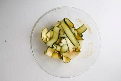 Boil half a kettle. Peel lengths of courgette[s] until you end up with a pile of courgette ribbons. Combine the ground turmeric with a generous pinch of salt, 1 tbsp [2 tbsp] sugar and 50ml [100ml] boiled water in a heatproof bowl and stir until the sugar has dissolved. Add the rice vinegar and courgette ribbons and set aside until serving – this is your quick-pickled courgette