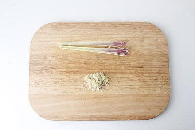 Meanwhile, bash the lemongrass with a rolling pin, cut down the middle lengthways, remove the tough outer layers (save them for later) and chop the softer inner core[s] finely