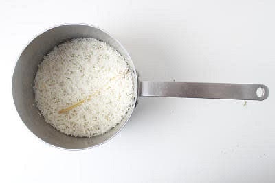 Add the white long grain rice to a pot with a lid with 175ml [350ml] cold water and the tough outer lemongrass layers, bring to the boil over a high heat. Once boiling, reduce the heat to very low and cook, covered, for 12-15 min or until all the water has absorbed and the rice is cooked. Once done, remove from the heat and set aside (lid on) to steam until serving