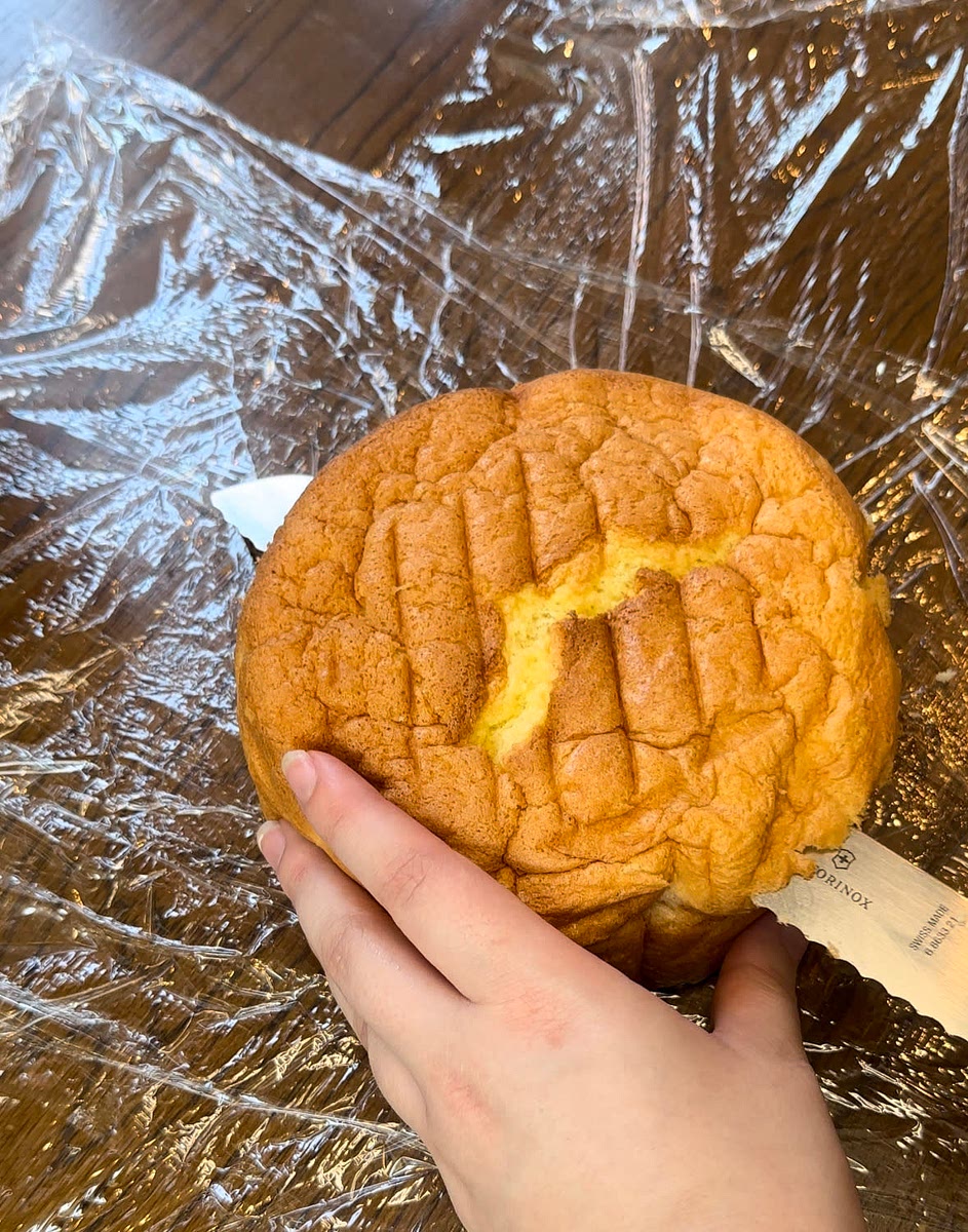 Once the cakes are cooled completely, use a sharp knife to go around the edge of the pans to release the cake onto flat plates. Slice each cake into two using a broad serrated knife. OR With a serrated knife, slice the top of the cake off to have one thick cake layer.