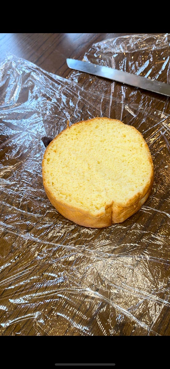 Wrap each cake layer in plastic wrap and place in refrigerator for around 15-30 minutes to let completely cool so it is easier to decorate.